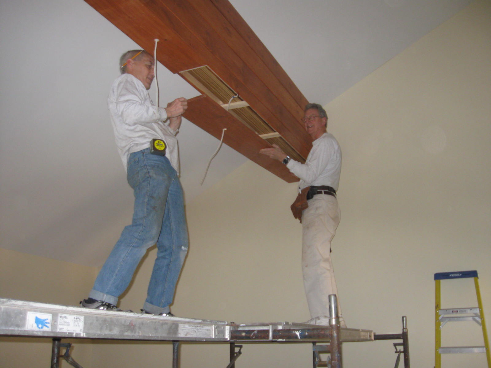 Wrapping the last beam in the new Concord Friends Meetinghouse