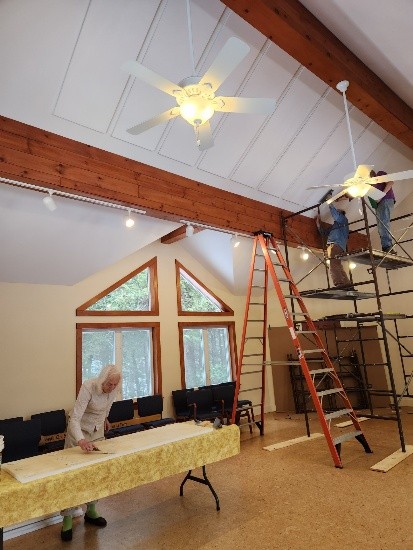 CMM Friends installing acoustic panels in the Meeting Room